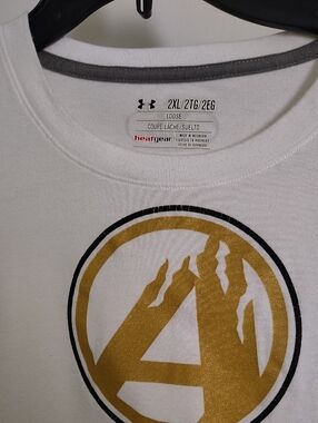 Under Armour Men’s White Short Sleeve Tee with Metallic Gold Graphic